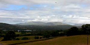 Image of the east face of the Old Man of Coniston on a changeable and unsettled day in the western fells.