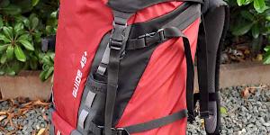 Image of a partially packed Deuter Guide 45+ in red.