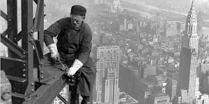 Iconic image of a New York steel worker tightening bolts high above the streets of Manhattan, long before Health and Safety existed.